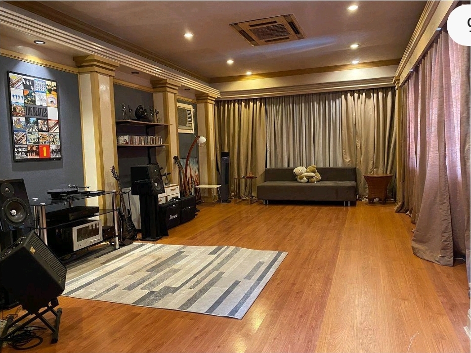 Music and entertainment room with timber flooring