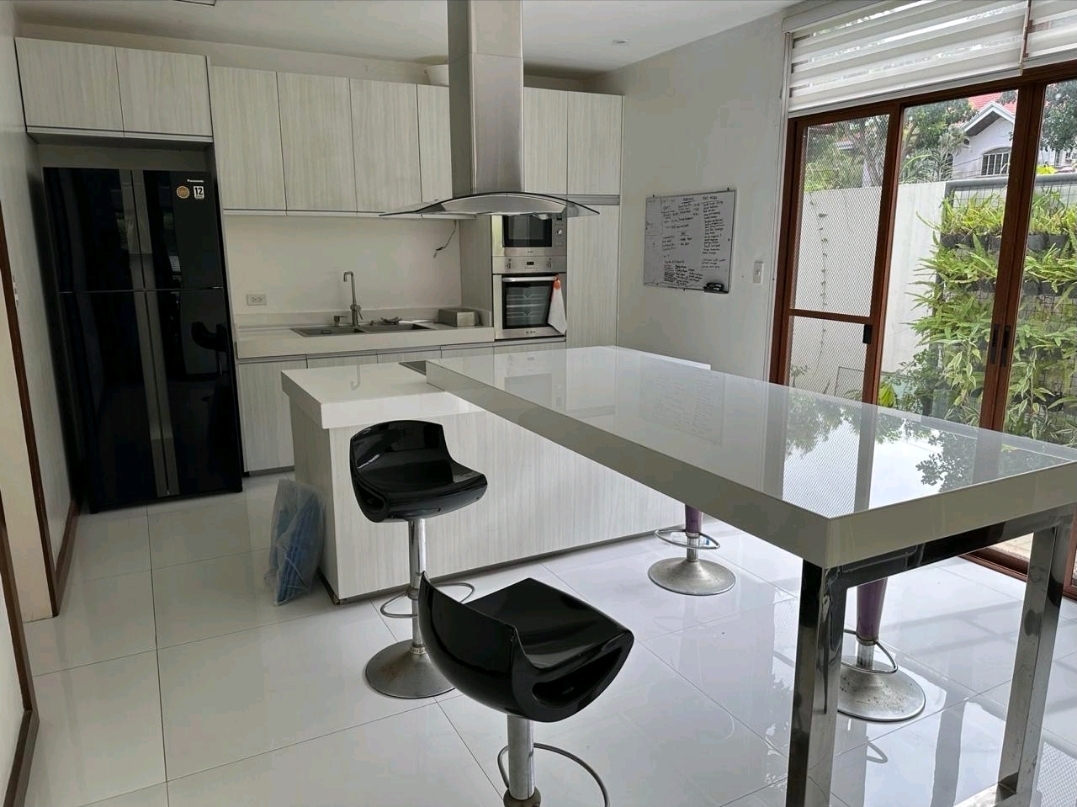 Gourmet kitchen with island, bar stools and stainless appliances