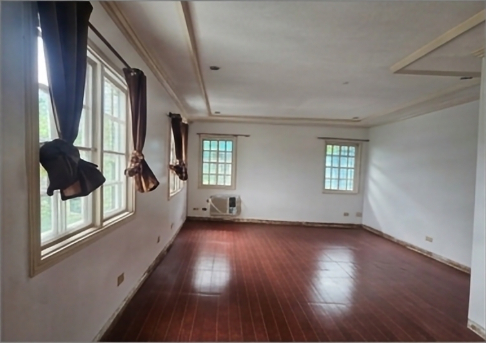 Upper bedroom with hardwood floors