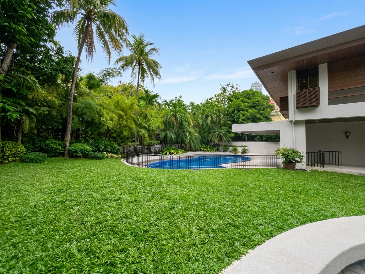 Expansive lawn, tropical garden and swimming pool