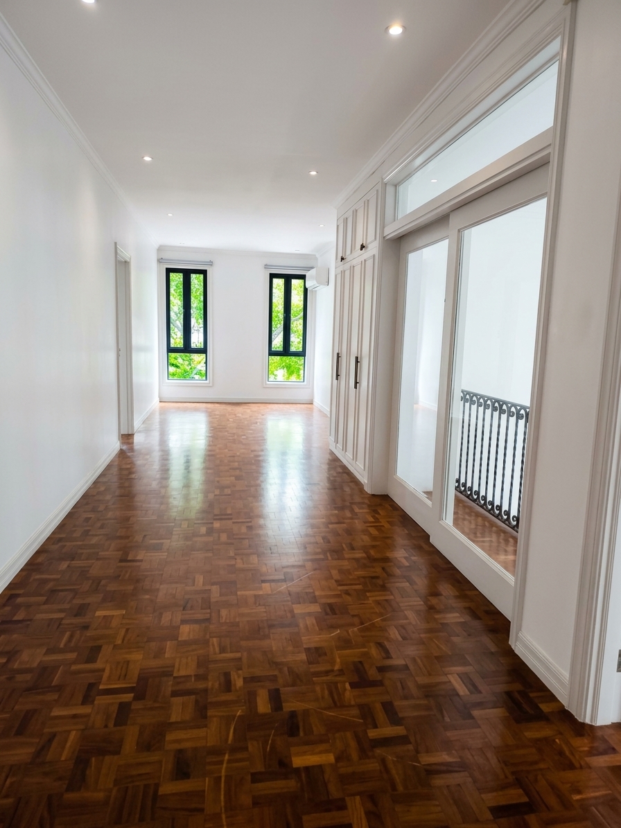 Upper hall with parquet flooring and built-in wardrobes