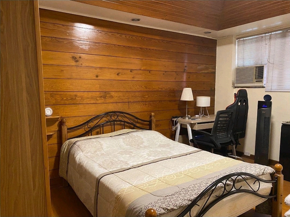 Bedroom with timber feature wall and study desk