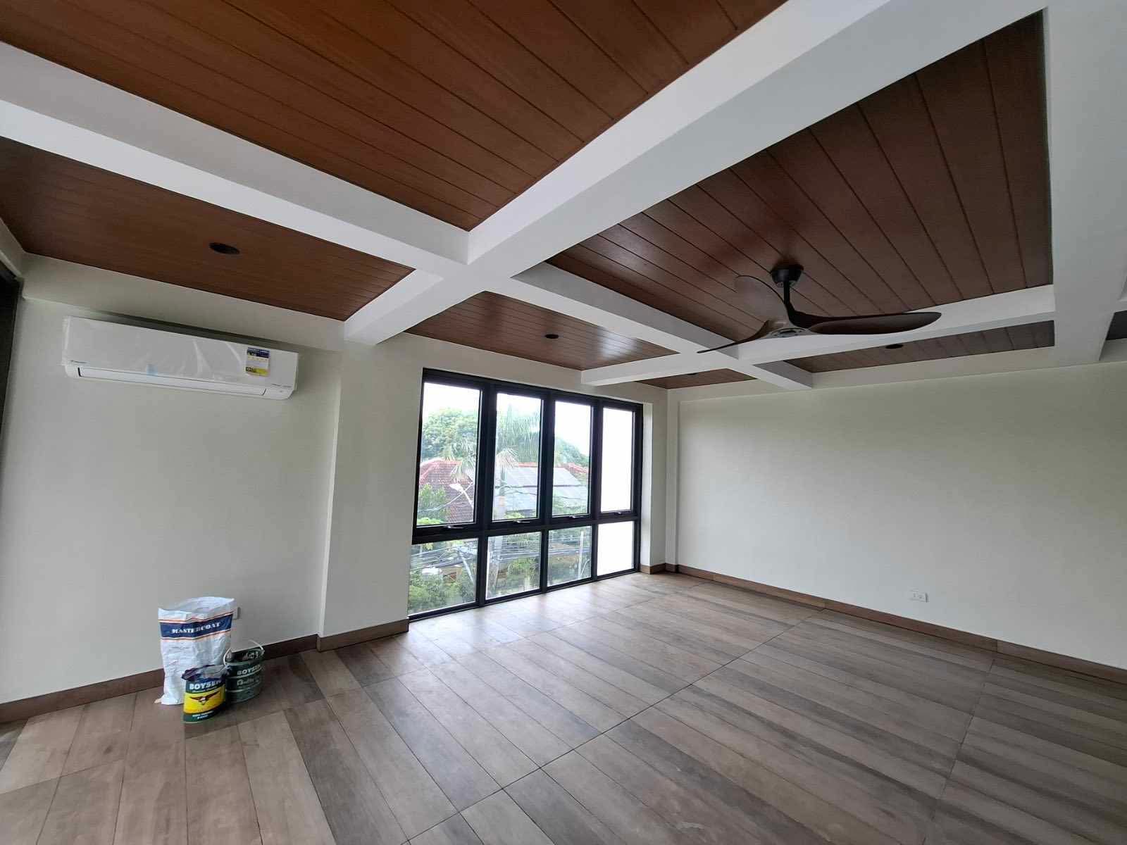Function hall with coffered wood ceiling and floor-to-ceiling windows