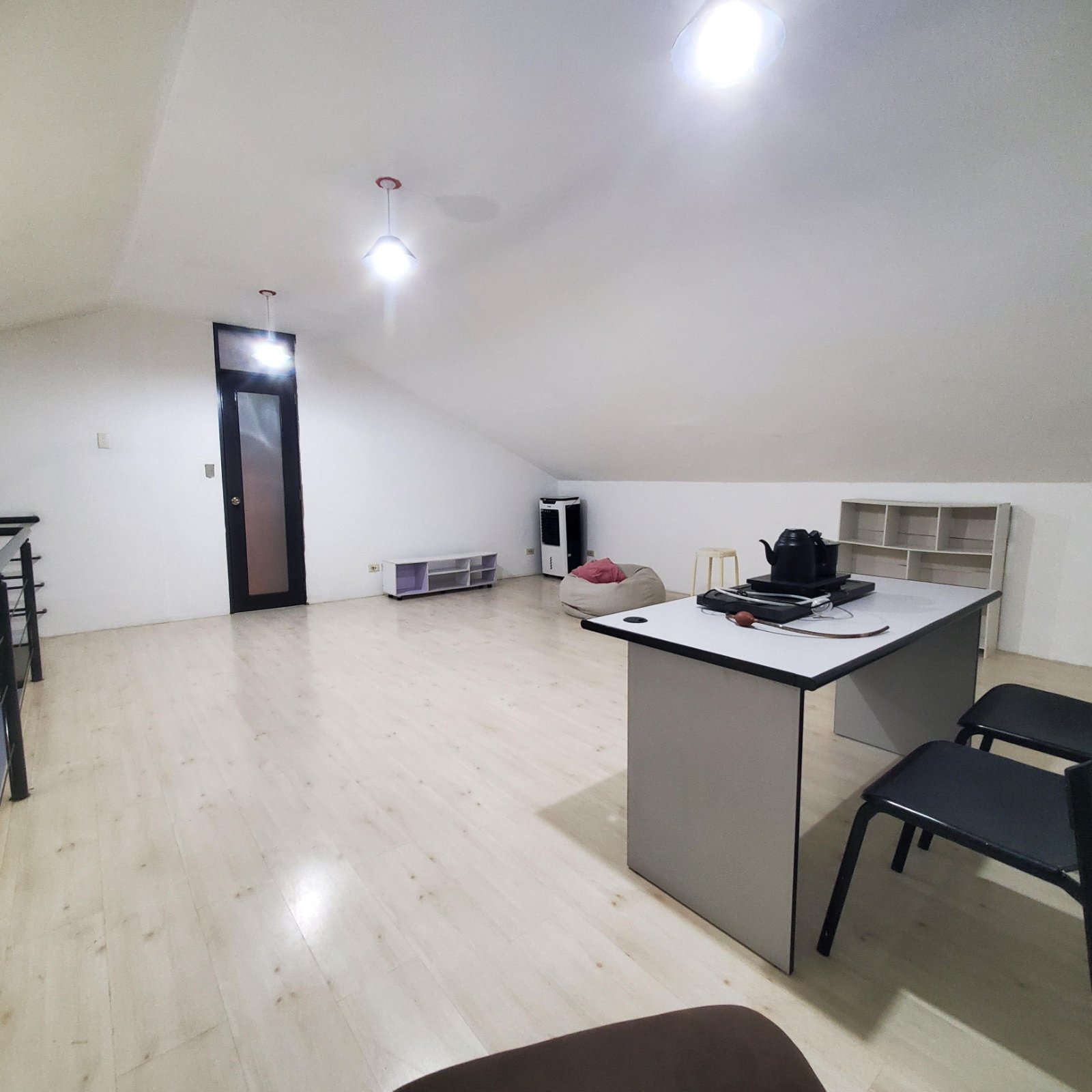 Mezzanine study space with storage cabinetry