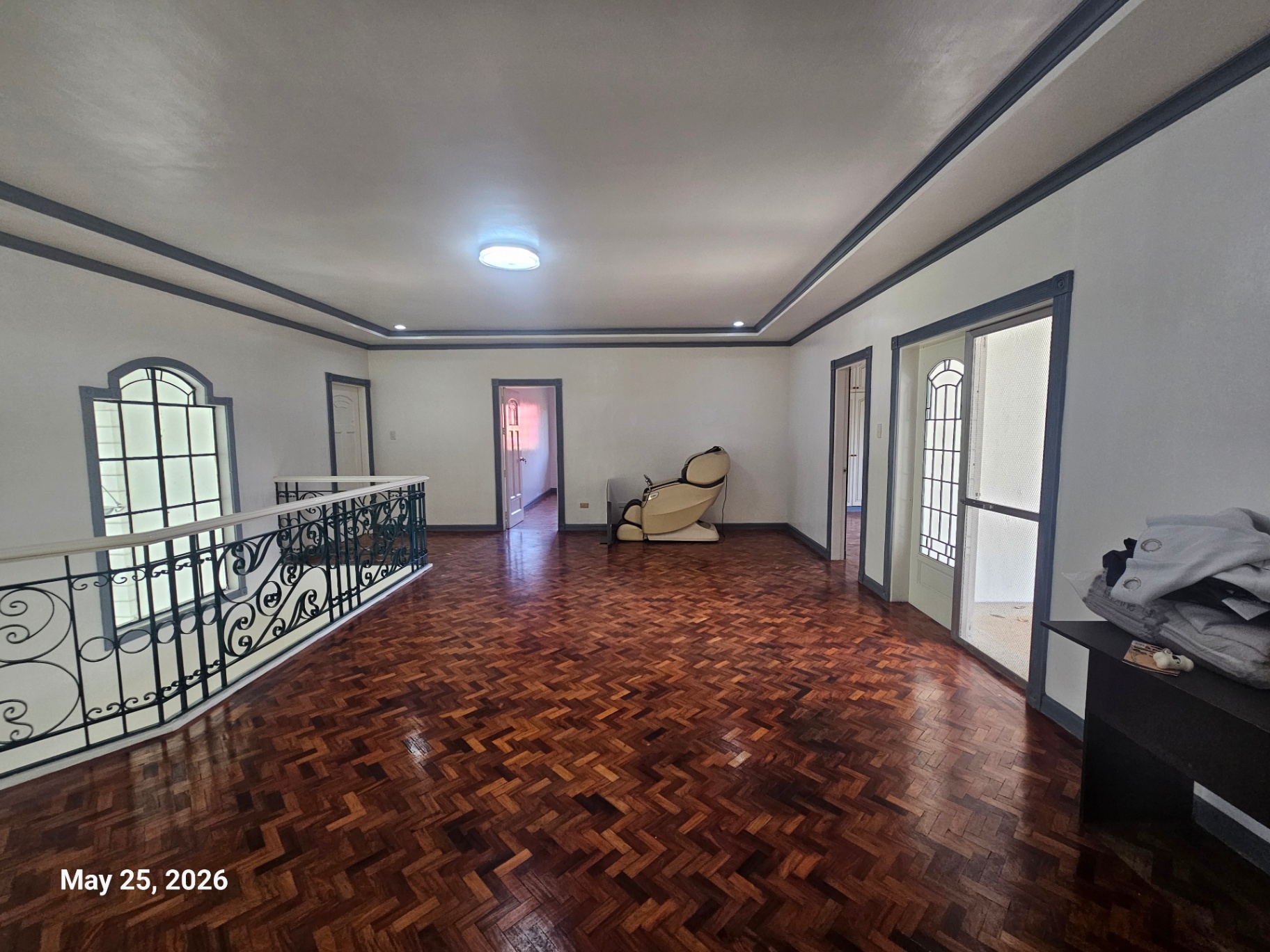 Upstairs family hall with parquet flooring