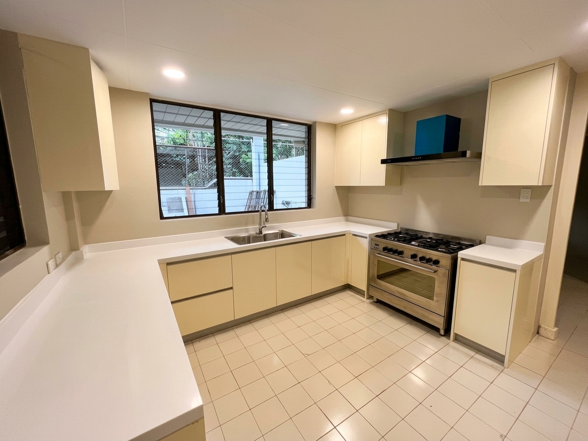 Service kitchen with professional range and garden window