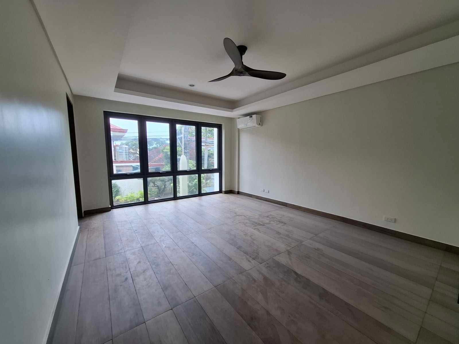 Bedroom with corner glass windows and tray ceiling