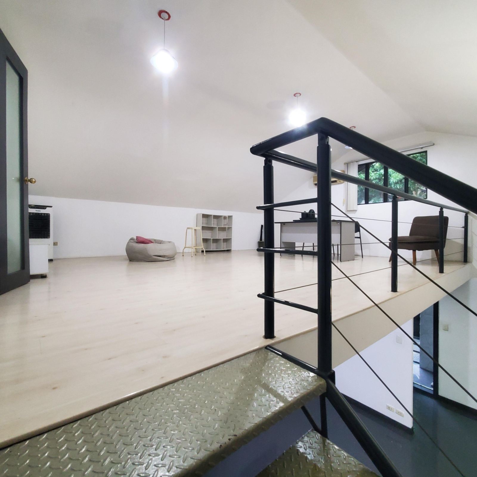 Mezzanine landing in light timber flooring
