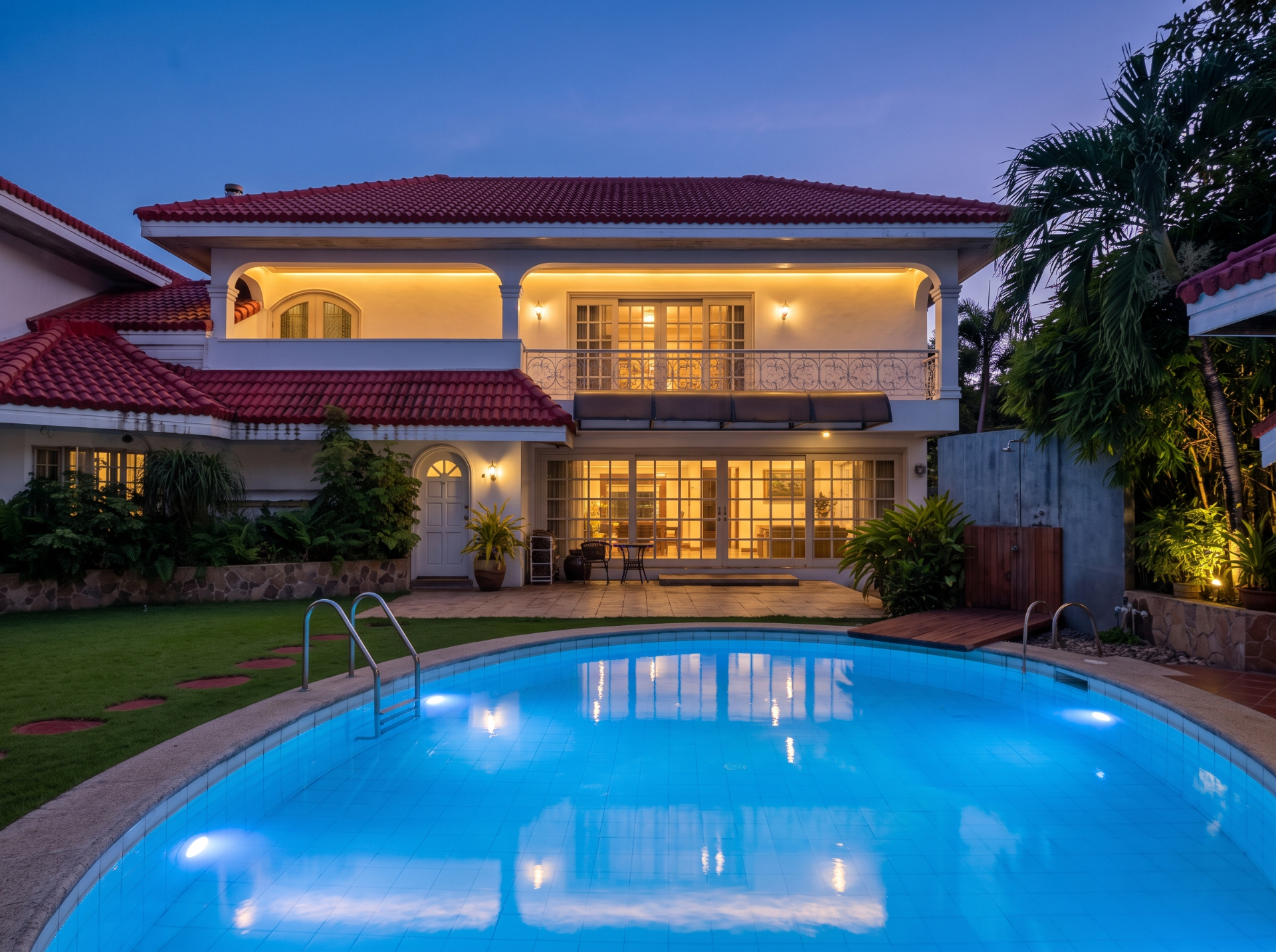 Pool-facing elevation at dusk — digitally enhanced
