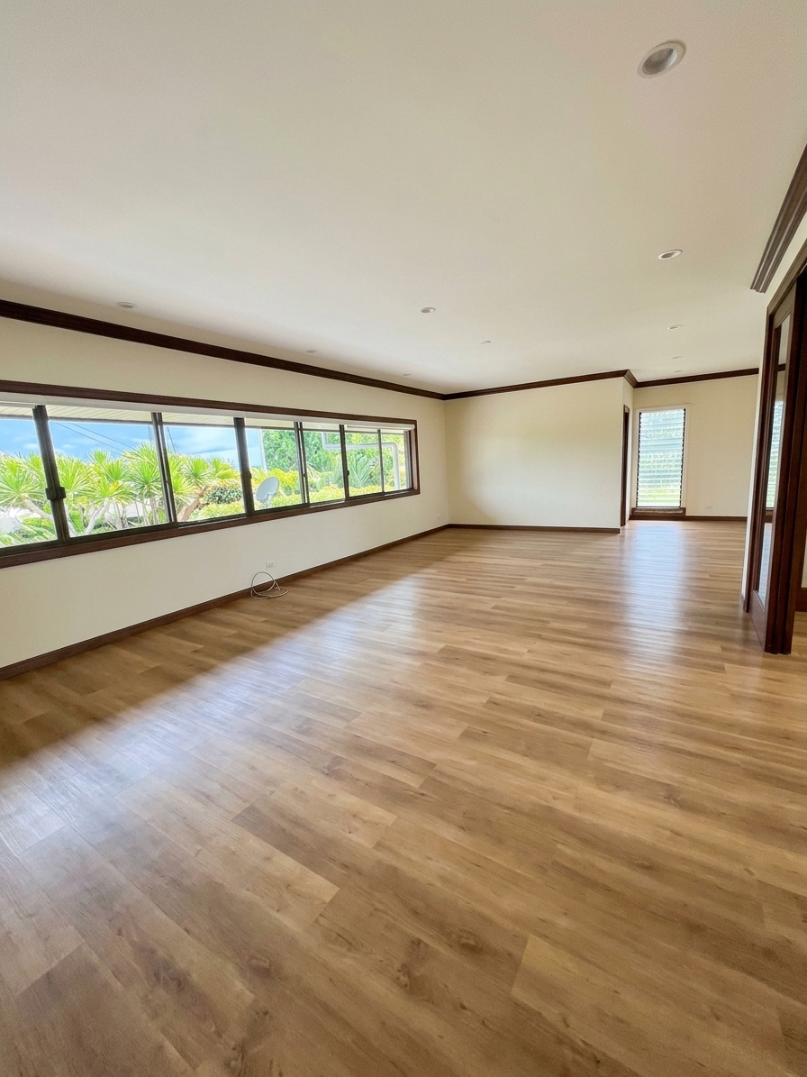 Bright living room with wood floors and garden windows