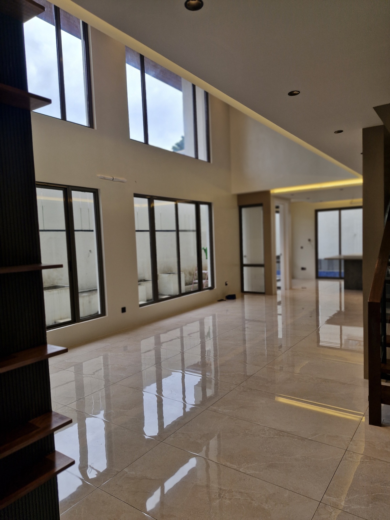 Double-height living area with tall windows