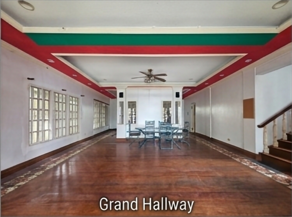 Grand hallway with hardwood flooring