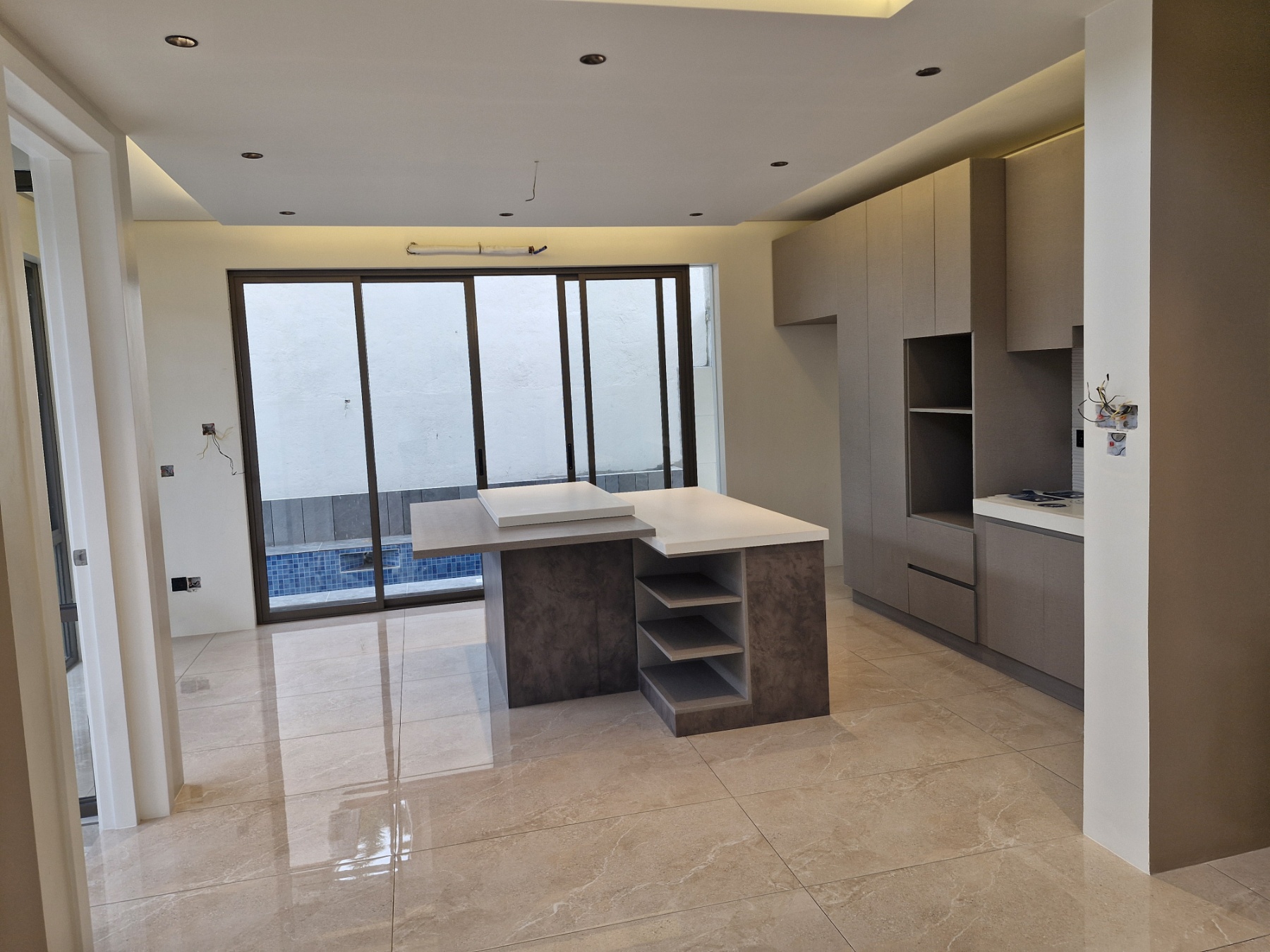 Main kitchen with island overlooking the swimming pool