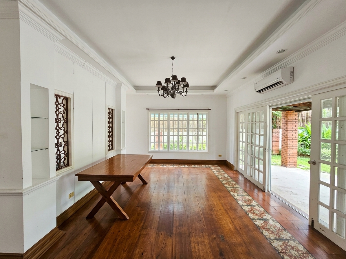 Formal dining room with hardwood floors, chandelier and garden access