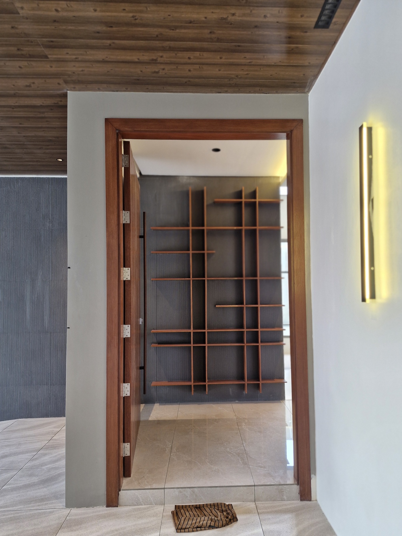 Wood-framed doorway and fitted shelving